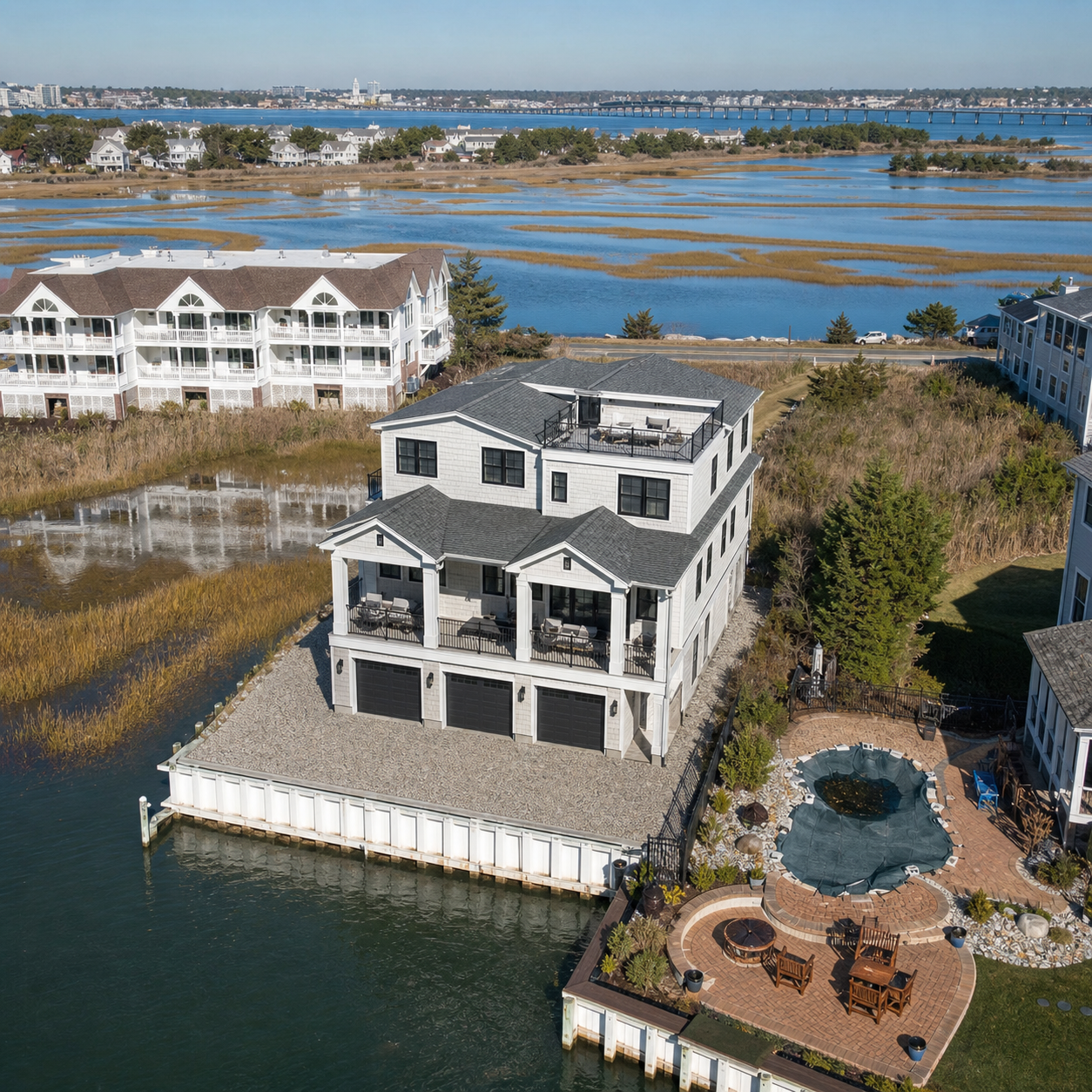 Aerial rendering of a 3-story bayfront residence at 104 Broadway, looking south toward the Ocean City bridge.