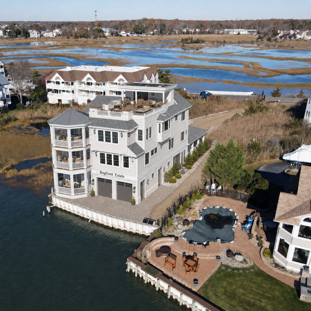 Conceptual rendering of the Bayfront Estate, a three-story residence with a stepped-back top floor and roof terrace.